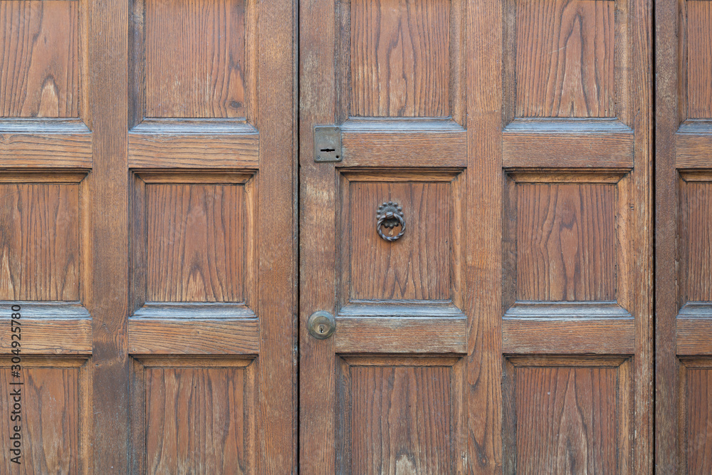 Wooden door background with iron door knocker Wooden door background with iron door knocker