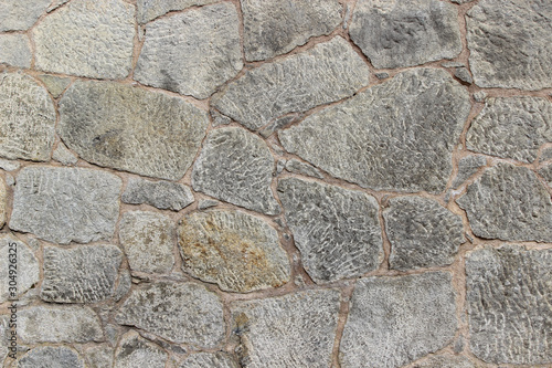Wall made of natural rocks of different sizes and shapes