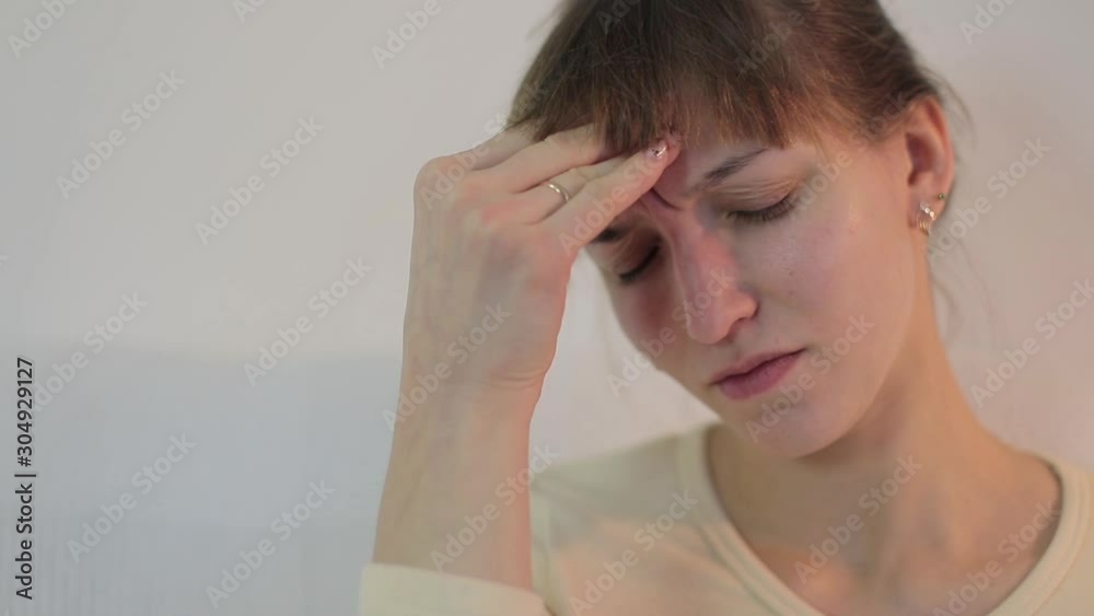 The girl caught a cold, is sick. She has problems with her throat and head, as well as a cough. The girl caught a cold, is sick. She has problems with her throat and head, as well as a cough.