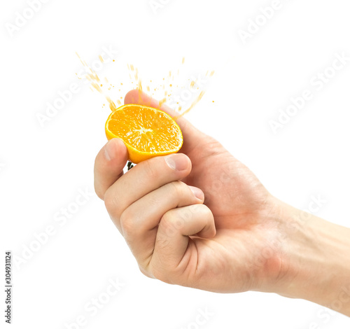 Hand holding a tangerine cut in half. Close up. Isolated on white background
