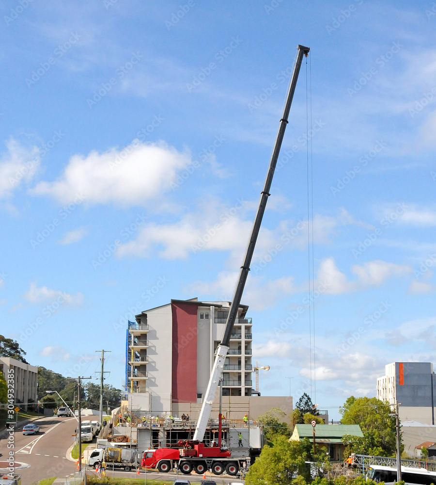 Assembling and erecting a construction Tower Crane with the aid of a Mobile Boom Crane. Australia.  2017. November 16,  8:14 AM.