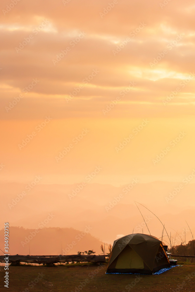 Camping tent on the mountain at sunrise.