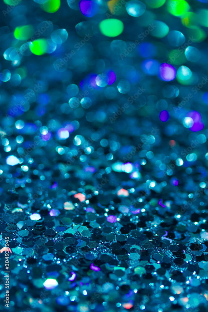 Abstract background of bright deep blue glitter texture with bokeh