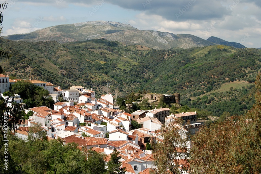 Elevated view of the town and castle in the mountains, Benadalid, Andalusia, Spain.