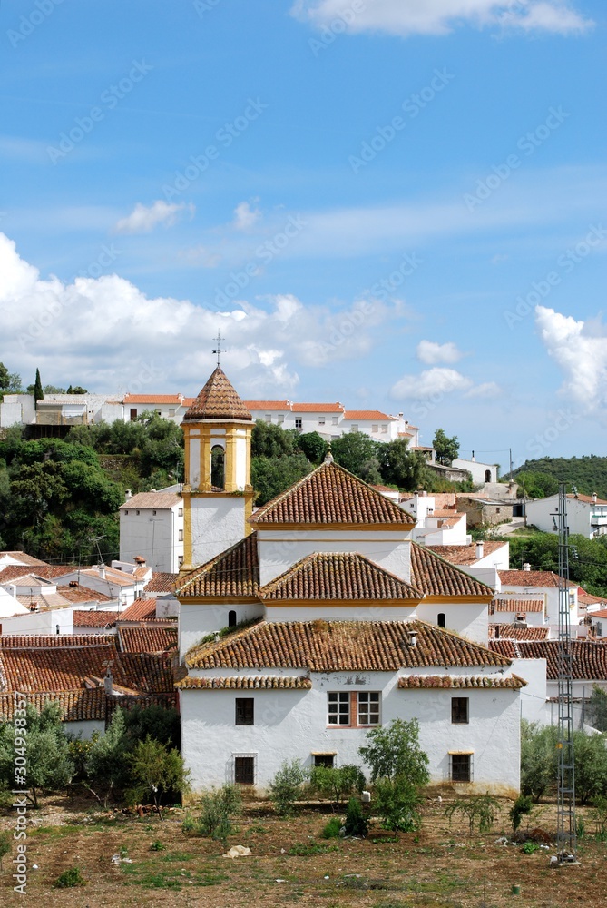 View of the white town and San Roque church with mountains to the rear, Atajate, Andalusia, Spain.