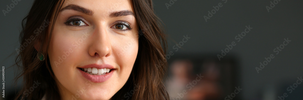 Beautiful smiling girl at workplace look in camera Beautiful smiling girl at workplace look in camera