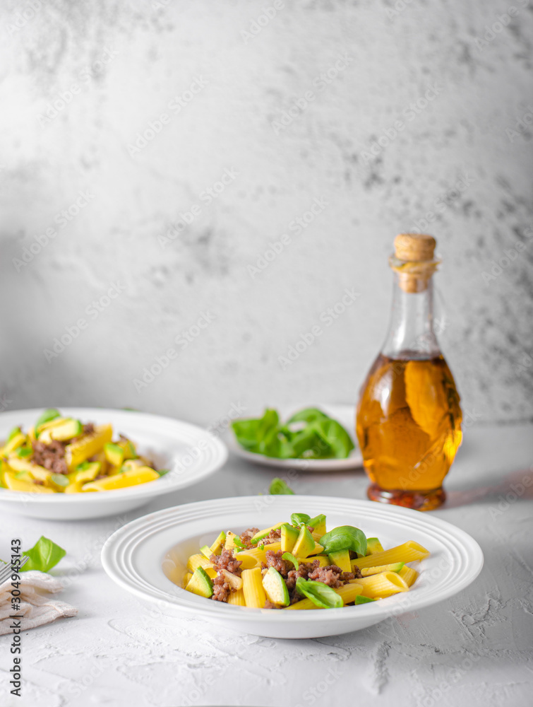 Delicous pasta with beef and fresh avocado