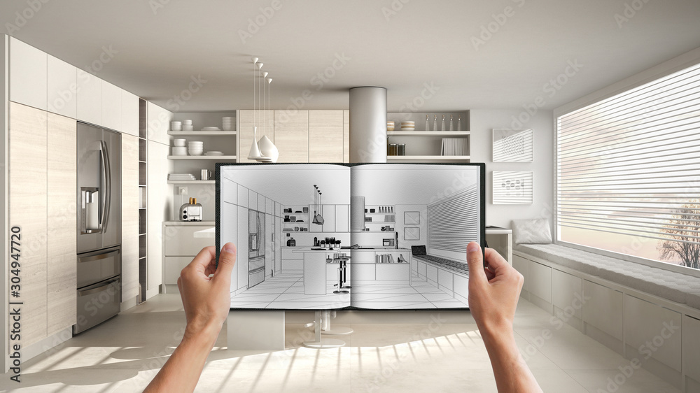 Hands holding notepad with creative kitchen design blueprint sketch or ...