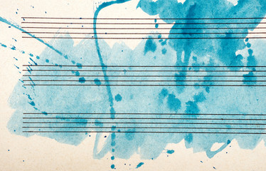 Old music sheet in blue watercolor paint. Blues music concept. Abstract blue watercolor background. 