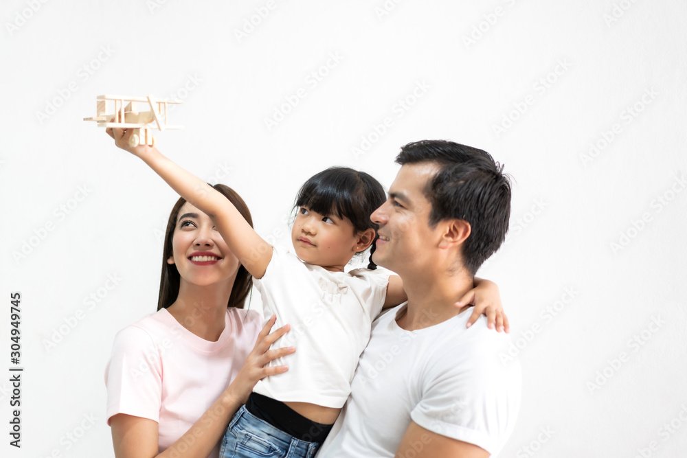 Portrait of happy family father and mother with daughter on white background Portrait of happy family father and mother with daughter on white background