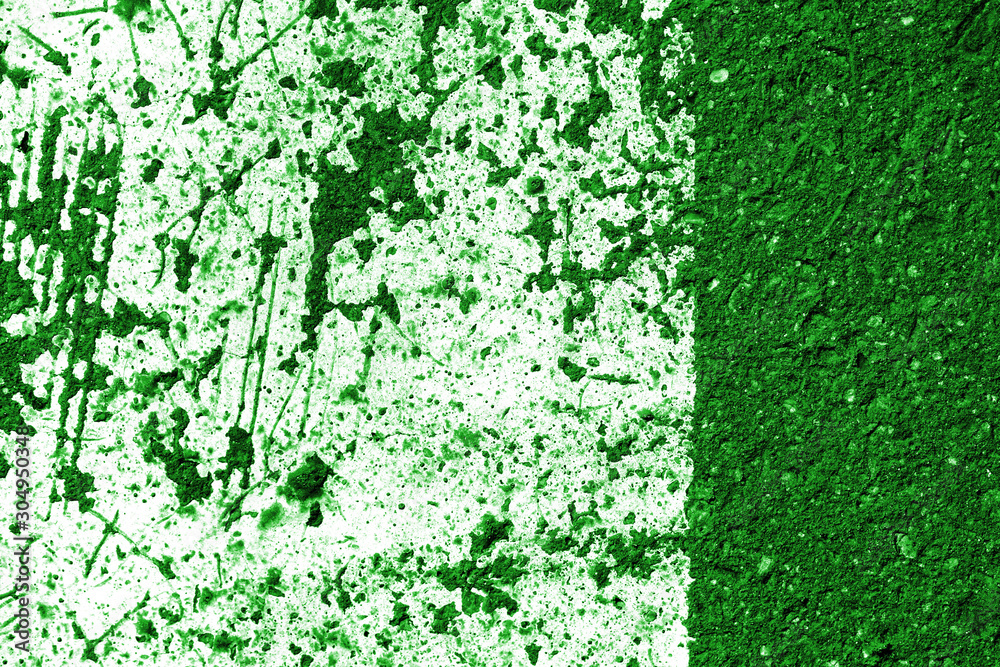 Old asphalt surface with white paint close-up, top view. Abstract background. Green color toned Old asphalt surface with white paint close-up, top view. Abstract background. Green color toned