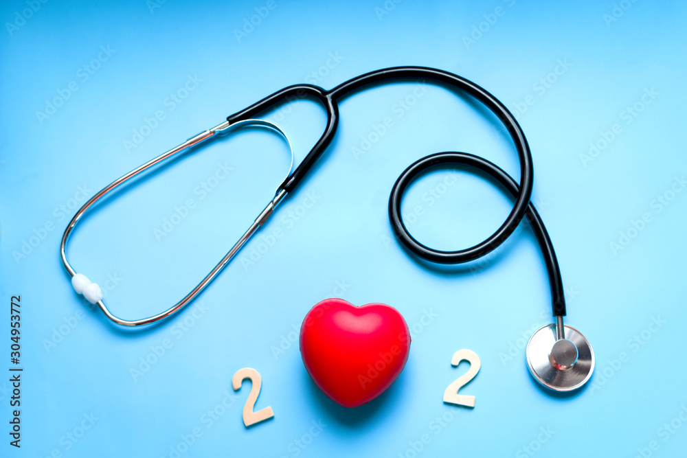 Happy New Year 2020 of doctor Stethoscope with red heart on blue background, Pharmacy and Happy New Year for medical and health concept Happy New Year 2020 of doctor Stethoscope with red heart on blue background, Pharmacy and Happy New Year for medical and health concept
