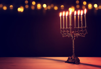 Religion image of jewish holiday Hanukkah background with menorah (traditional candelabra) and candles