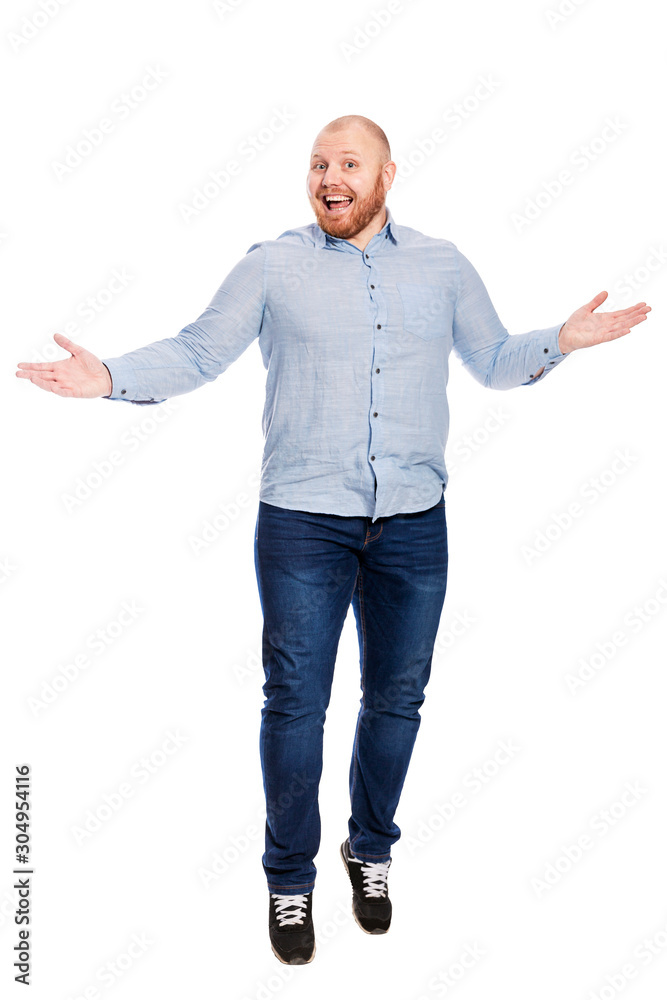 Laughing man with a red beard in jeans and a blue shirt. Full height. Isolated over white background. Vertical. Laughing man with a red beard in jeans and a blue shirt. Full height. Isolated over white background. Vertical.