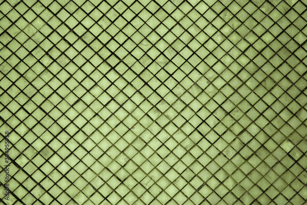 Abstract - Sculpture of Green wall texture square patterns of pagoda at Wat Phra Si Rattana Satsadaram or Royal Grand Palace buddha temple Bangkok Thailand. Abstract - Sculpture of Green wall texture square patterns of pagoda at Wat Phra Si Rattana Satsadaram or Royal Grand Palace buddha temple Bangkok Thailand.
