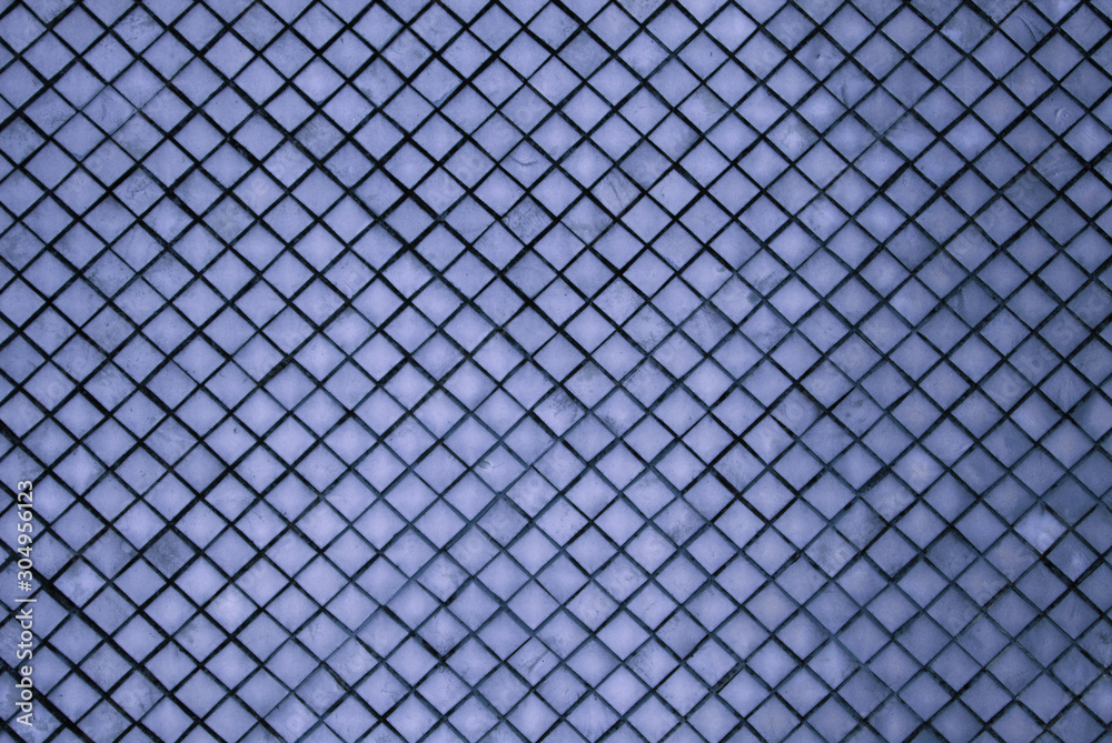 Abstract - Sculpture of blue wall texture square patterns of pagoda at Wat Phra Si Rattana Satsadaram or Royal Grand Palace buddha temple Bangkok Thailand. Abstract - Sculpture of blue wall texture square patterns of pagoda at Wat Phra Si Rattana Satsadaram or Royal Grand Palace buddha temple Bangkok Thailand.