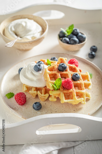 Delicious waffles with fresh blueberries and raspberries