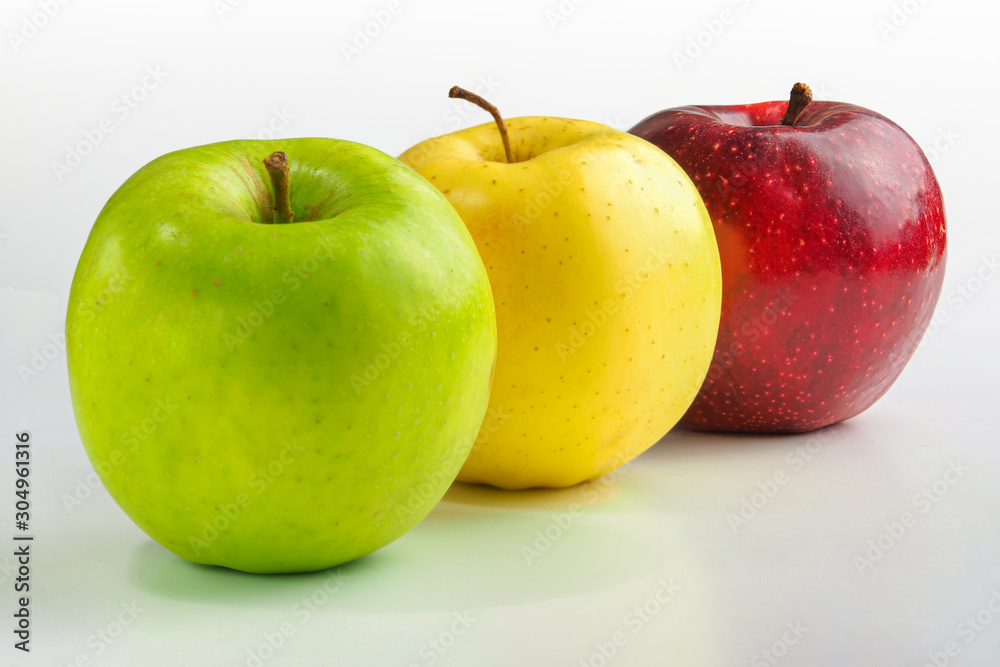 Apples green, yellow and red on a white background. Apples green, yellow and red on a white background.