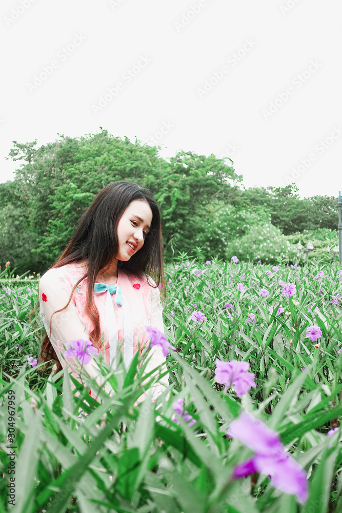 Portrait of beautiful young asian woman relaxing in garden Portrait of beautiful young asian woman relaxing in garden