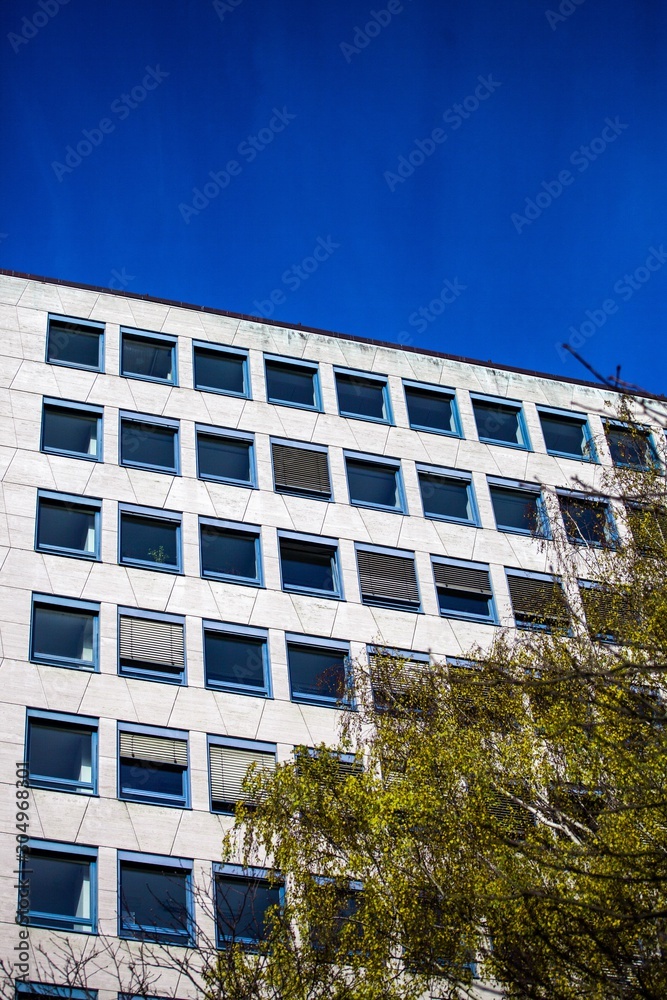 Generic white office building on blue sky