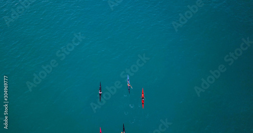 фотографія Aerial image of kayakers paddling forwards
