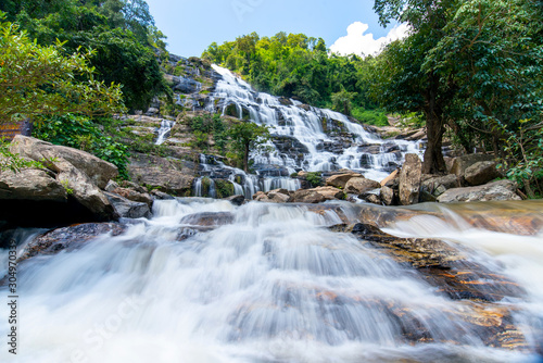 Beautiful landscape view of waterfall in Thailand with blue sky