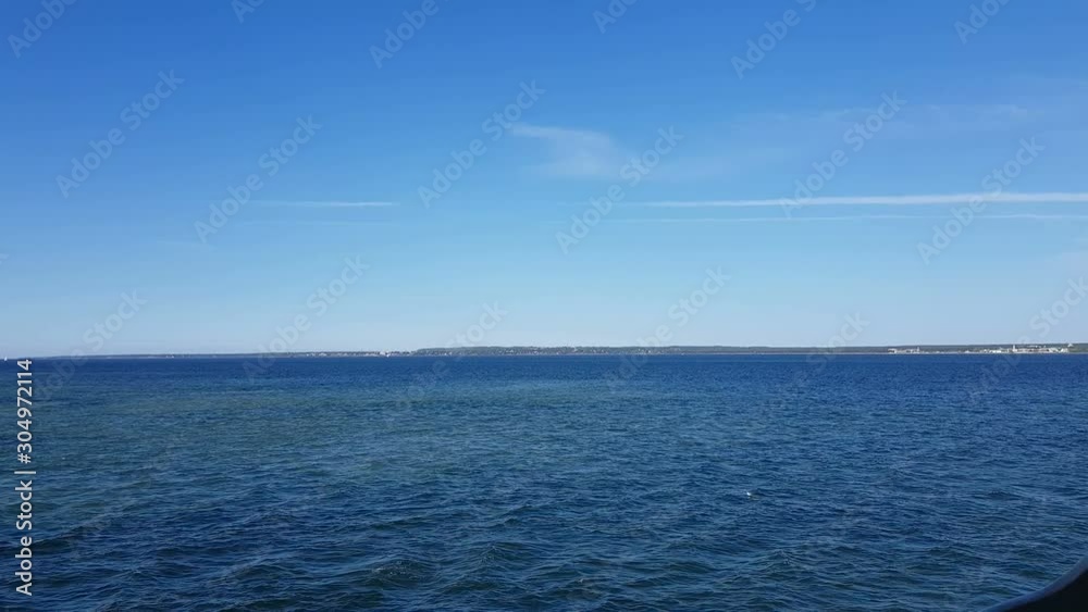 View of the ocean and clouds in the sky. Blue sky with clouds in sunny weather over the ocean. View of the ocean and clouds in the sky. Blue sky with clouds in sunny weather over the ocean.