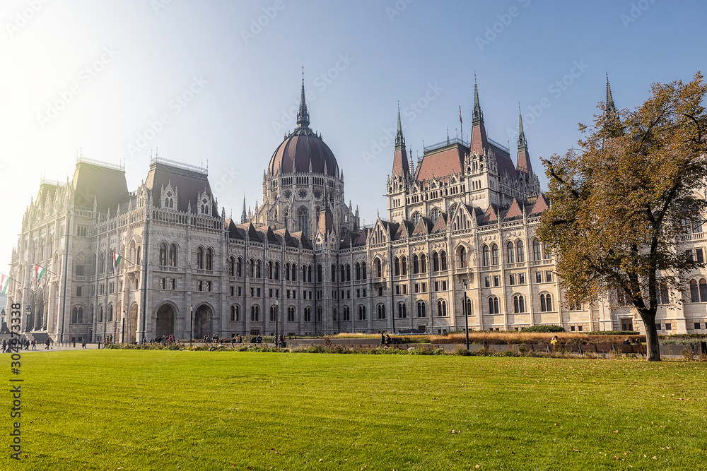 Hungarian Parliament famous building and green lawn on a sunny day