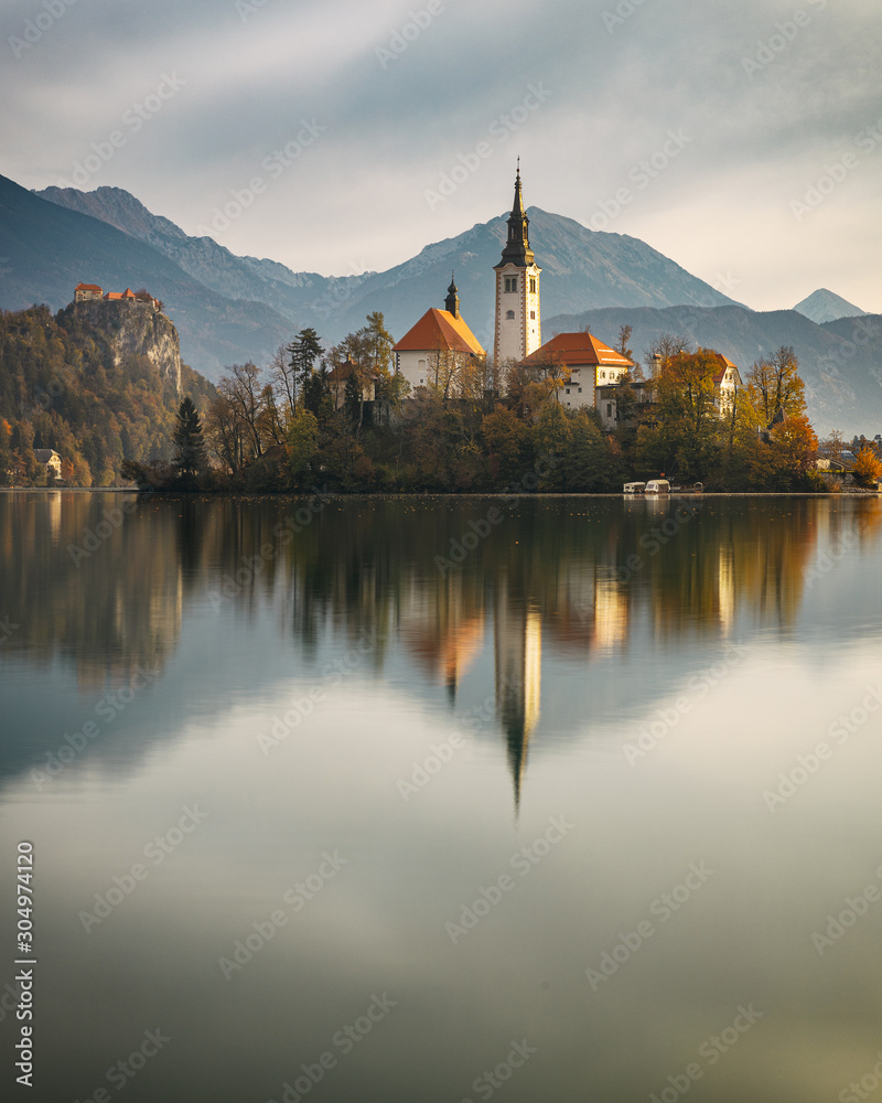 Amazing autumn scenery of lake Bled with and island reflection, Slovenia