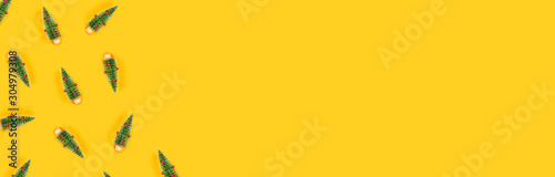 Web-banner with yellow background and christmas trees.