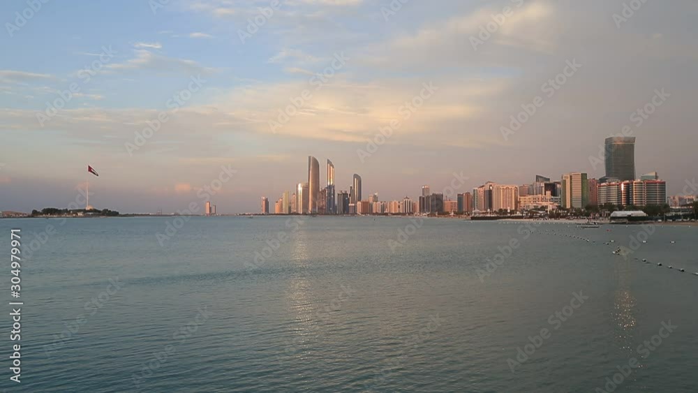 Abu Dhabi skyline at sunset. Establishing shot. Abu Dhabi skyline at sunset. Establishing shot.