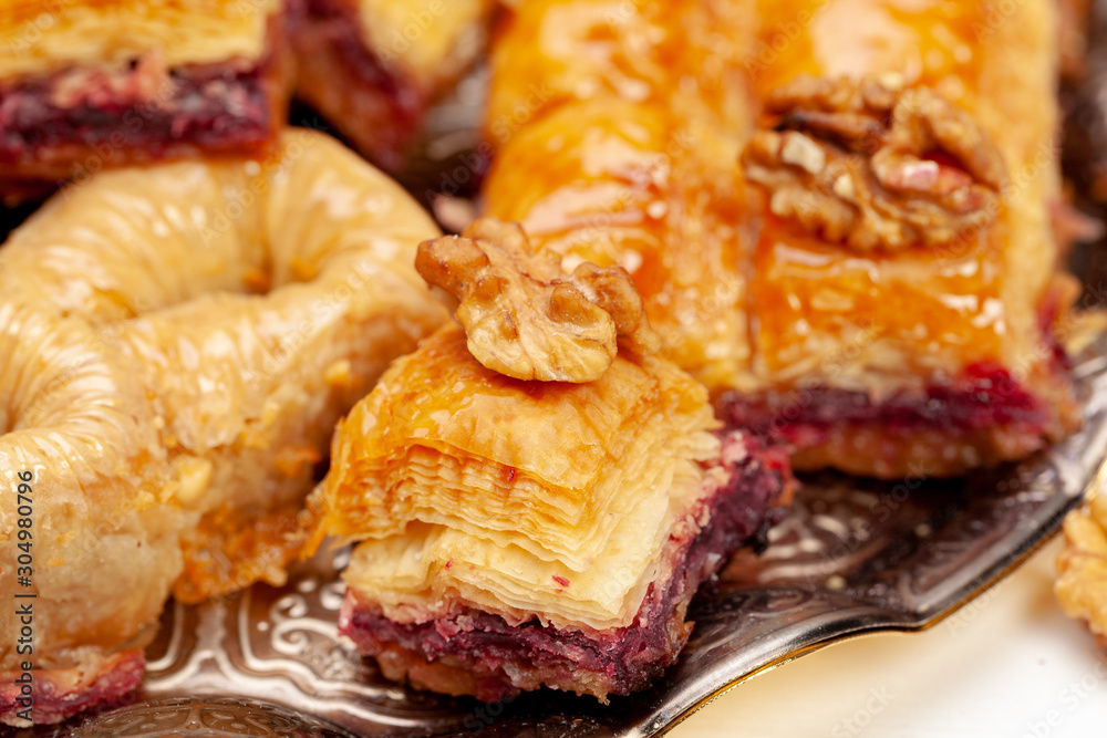 Stacked turkish baklava dessert in a plate close up Stacked turkish baklava dessert in a plate close up
