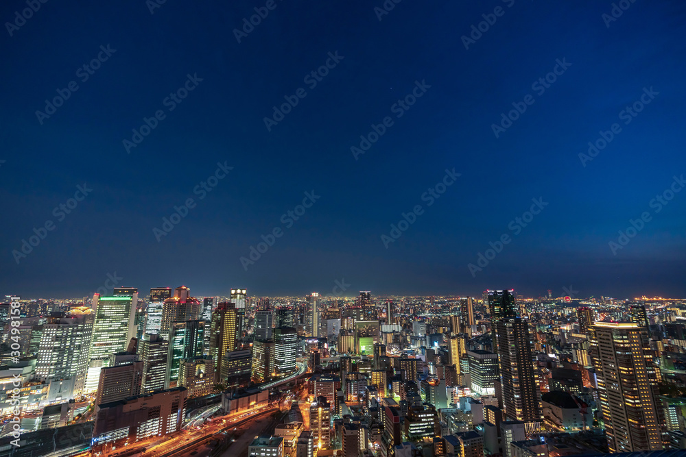 Osaka city night life view from top of higg building beautiful sky twilight urban light