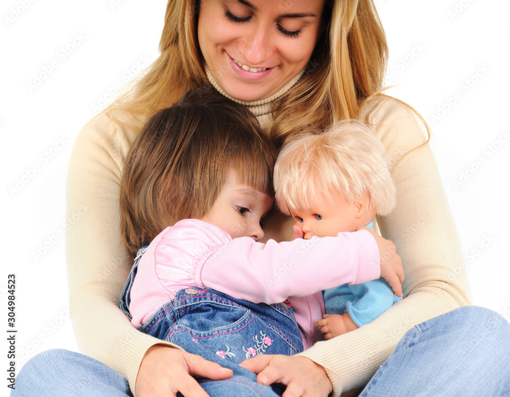 Happy mother embracing little daughter and her doll Happy mother embracing little daughter and her doll