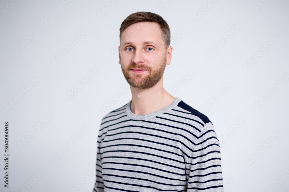 portrait of handsome bearded man posing over white portrait of handsome bearded man posing over white