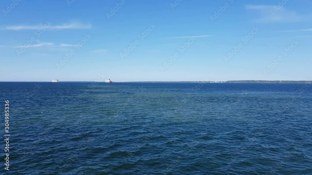 View of the ocean and clouds in the sky. Blue sky with clouds in sunny weather over the ocean. View of the ocean and clouds in the sky. Blue sky with clouds in sunny weather over the ocean.