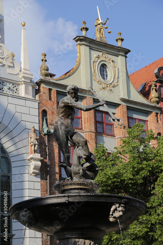 Poland, Gdansk - 06.06.2019: View of the Neptune Fountain and the Artus Court.