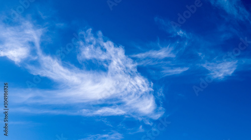 Beautiful cirrus cloud formations in a deep blue sky photo