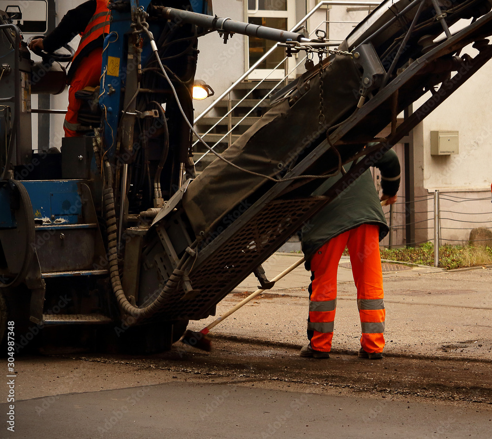 Fototapeta premium Road works with transport and men in uniform