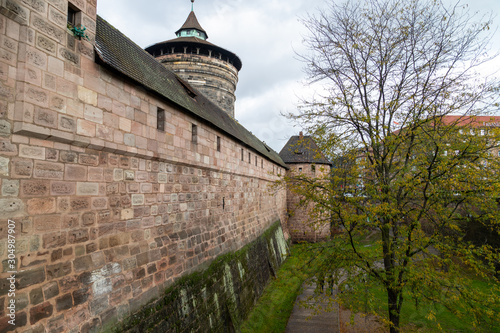 Historic wall and tower at Handwerkerhof in city Nuremberg, Bavaria, Germany photo