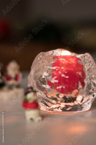 Christmas decoration, snowmen, candles and Santa Claus, light and shadow, selective focus