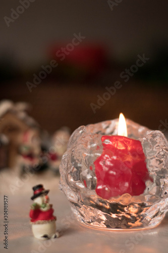 Christmas decoration, snowmen, candles and Santa Claus, light and shadow, selective focus