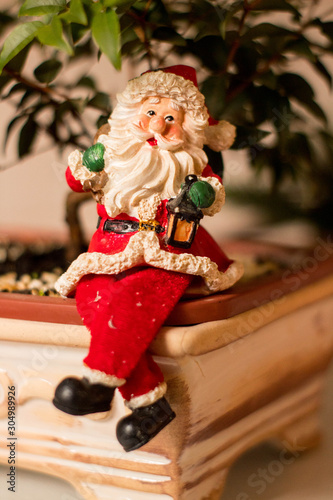 Christmas decoration, snowmen, candles and Santa Claus, light and shadow, selective focus