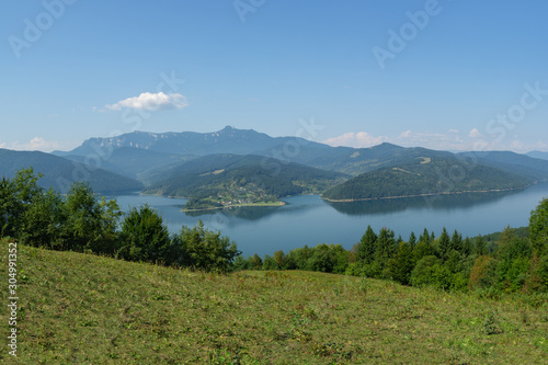 Lake Bicaz (Lake Izvorul Muntelui) in Romania. Massif Ceahlau on the background