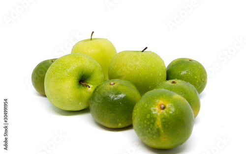 Fresh green apples and oranges isolated on white background.