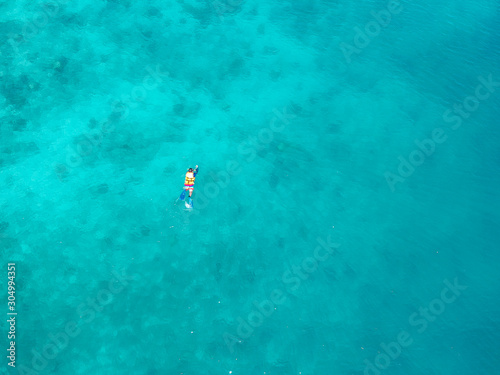 Top view Man snorkeling on nature beautiful blue ocean 