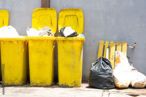 City waste with yellow bin , Dirty village dump site