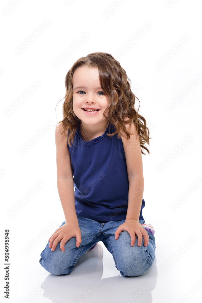 Little lovely girl smiling and looking at camera, studio shot over white background. Little lovely girl smiling and looking at camera, studio shot over white background.