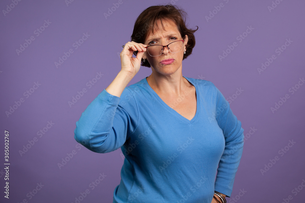 Woman adjusting her glasses Woman adjusting her glasses
