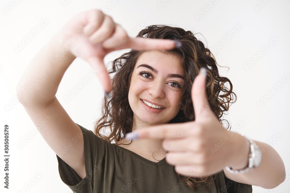 Creative charismatic attractive young armenian photographer imaging how shot look picturing idea show frame look through pleased happy smiling camera, tilting head delighted, fantasizing
